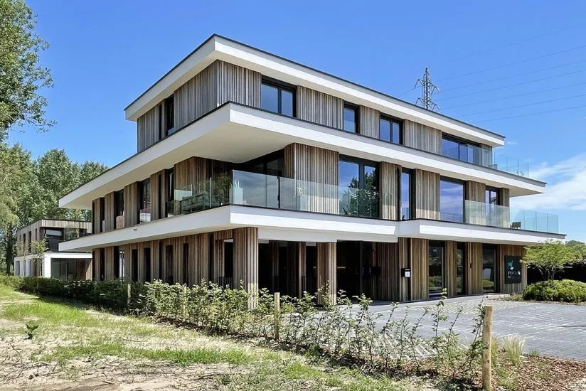 Un immeuble d'appartements en CLT terminé, dont les techniques HVAC ont été conçues en BIM par VDB Engineering