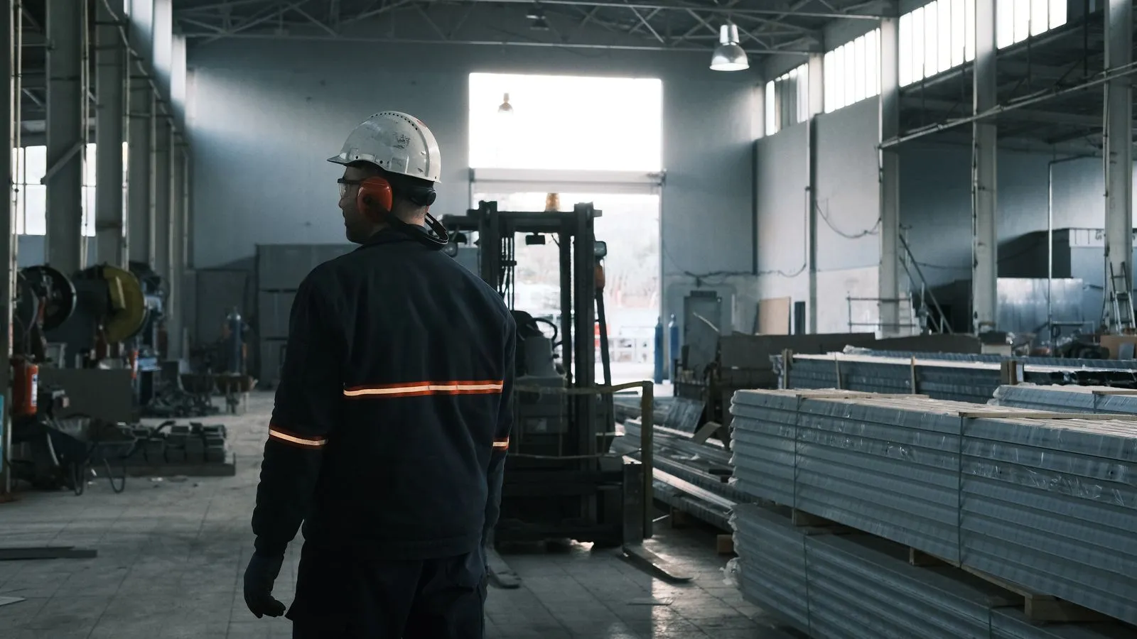 A worker on an industrial production floor